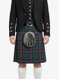 Person wearing a black jacket, tartan kilt, and white socks on a white background