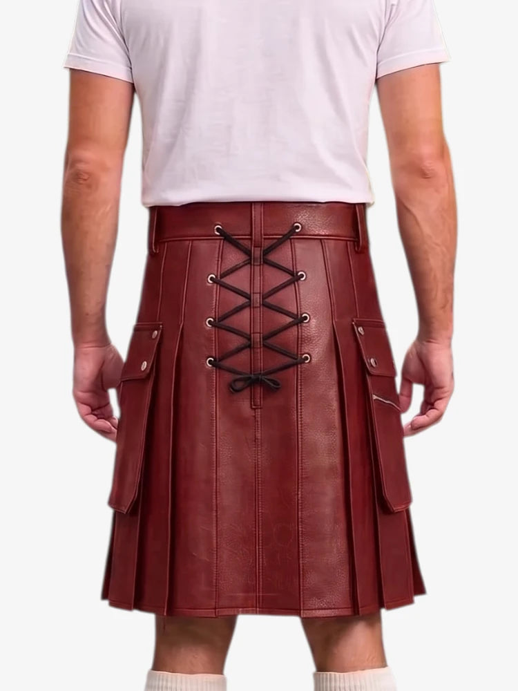 A person shown from the back wearing a dark red faux-leather pleated kilt with a black lace-up closure and side pockets, paired with a light pink t-shirt and white socks against a white background.