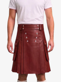 A person wearing a dark reddish-brown faux leather kilt with silver-tone metal buttons and flap pockets, paired with a white t-shirt against a plain white background.