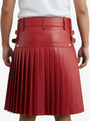 Red pleated skirt worn by a person on a white background