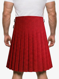 Red pleated skirt worn by a person on a white background
