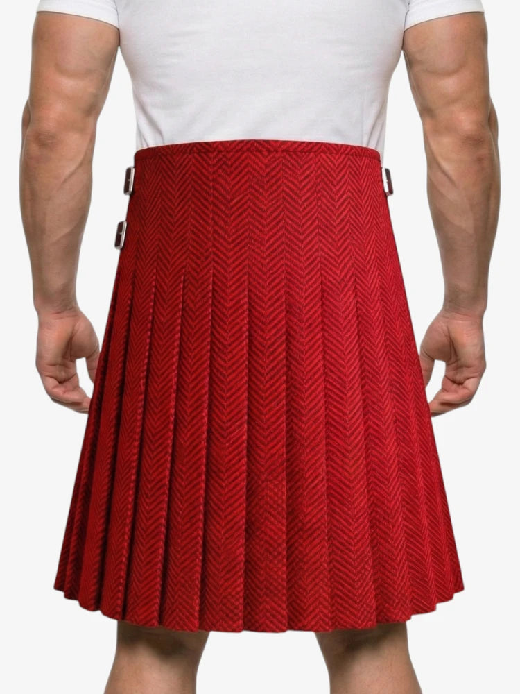 Red pleated skirt worn by a person on a white background