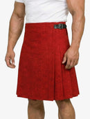 Red patterned kilt worn by a person on a white background