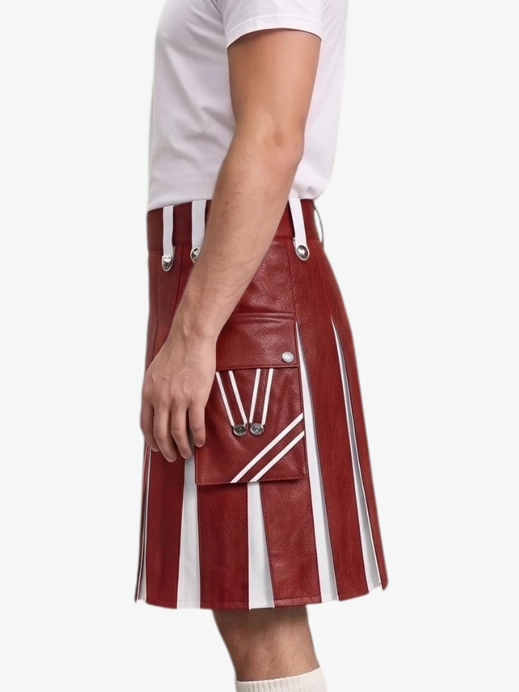 A person wearing a red leather kilt with white vertical pleats and a front flap pocket featuring white stripes and silver hardware, paired with a white t-shirt against a light gray background.