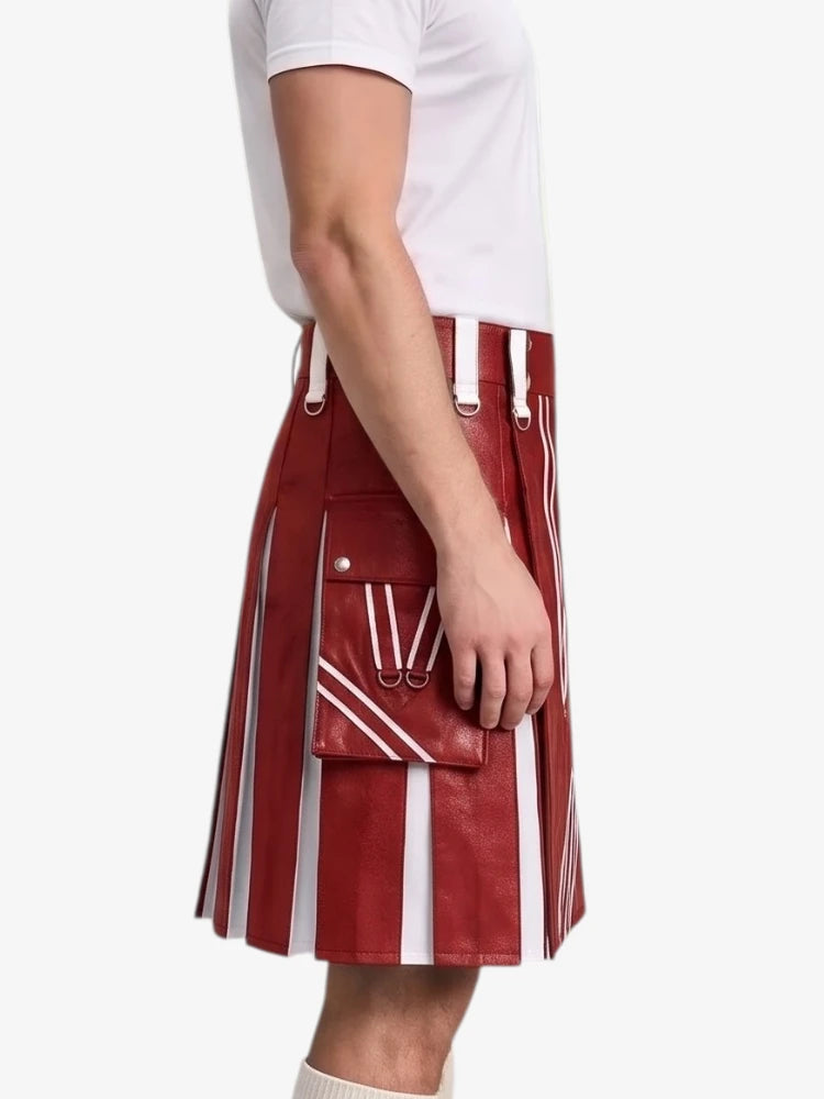 A model wearing a red and white vertically striped leather kilt with white leather suspenders and a matching red leather belt pouch, paired with a white t-shirt against a light gray background.