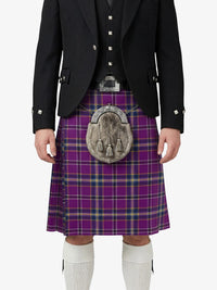 Person wearing a Scottish kilt with a purple plaid pattern on a white background