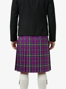 Person wearing a black jacket and purple plaid skirt on a white background