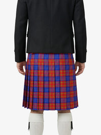 Person wearing a black coat and red plaid kilt on a white background