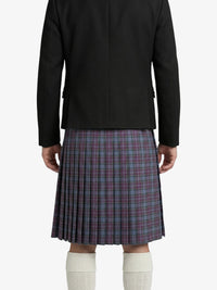 Person wearing a black jacket and plaid kilt on a white background