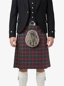 Person wearing a traditional Scottish kilt with a tartan pattern on a white background