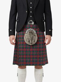 Person wearing a traditional Scottish kilt with a tartan pattern on a white background