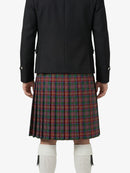 Person wearing a black jacket and red plaid kilt on a white background