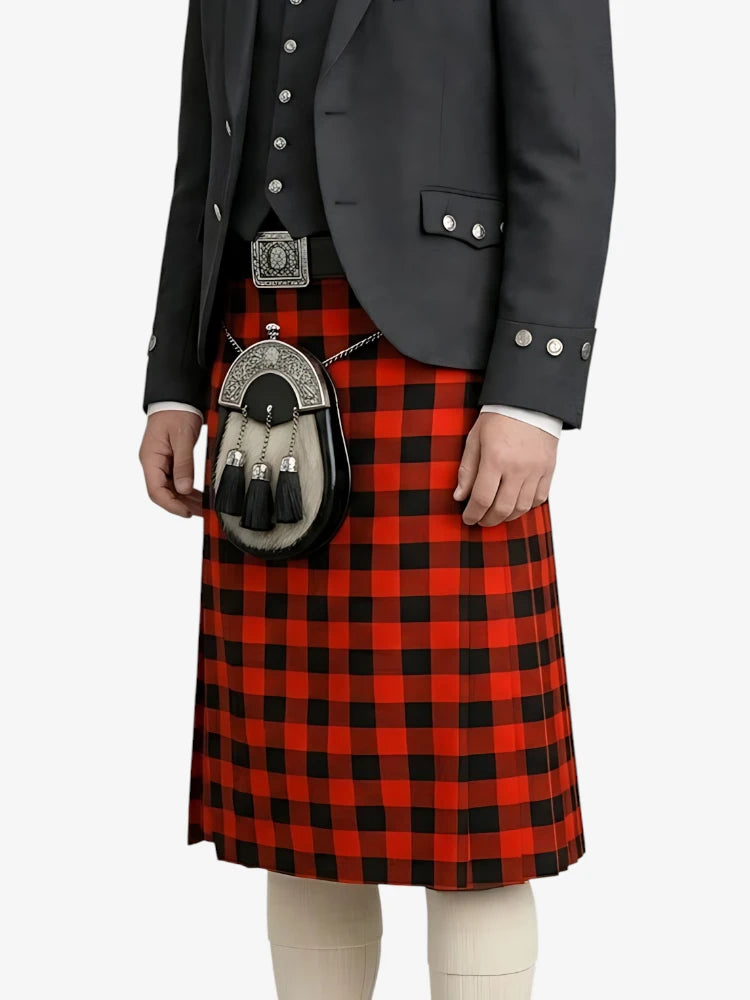 Person wearing a traditional Scottish kilt with a black jacket on a white background