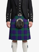 Person wearing a traditional Scottish kilt with a tartan pattern on a white background