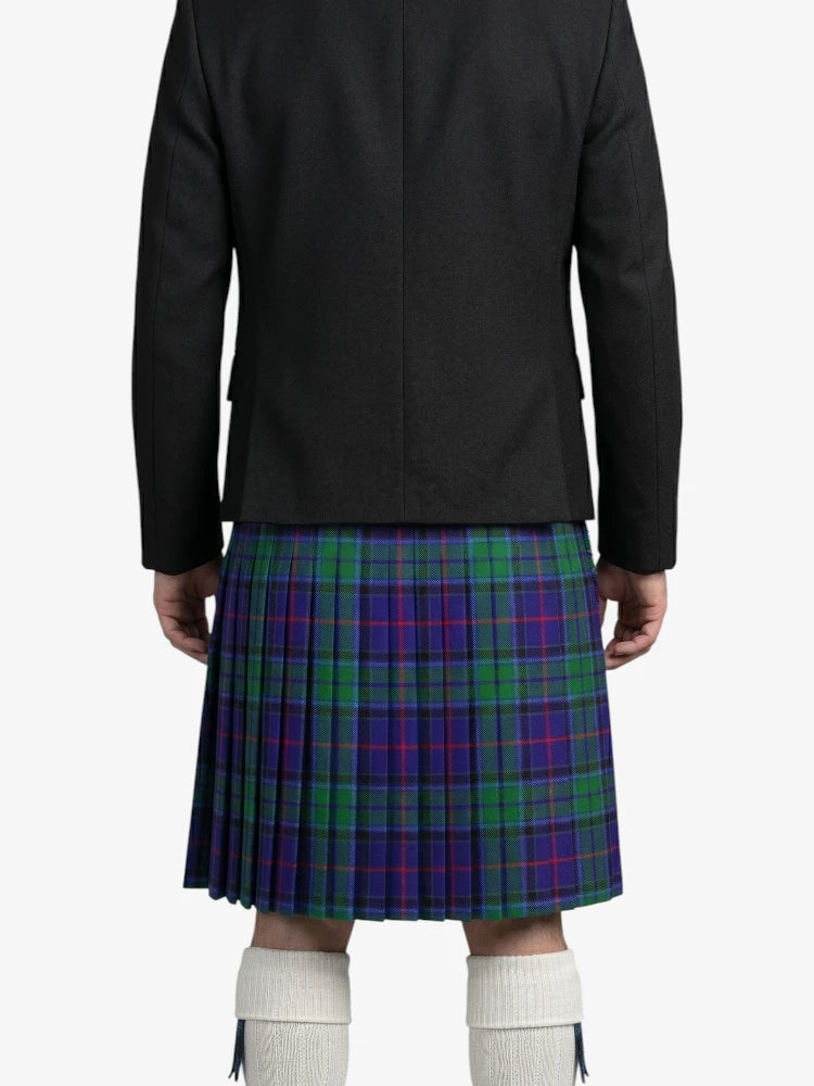 Person wearing a black jacket and a plaid kilt on a white background