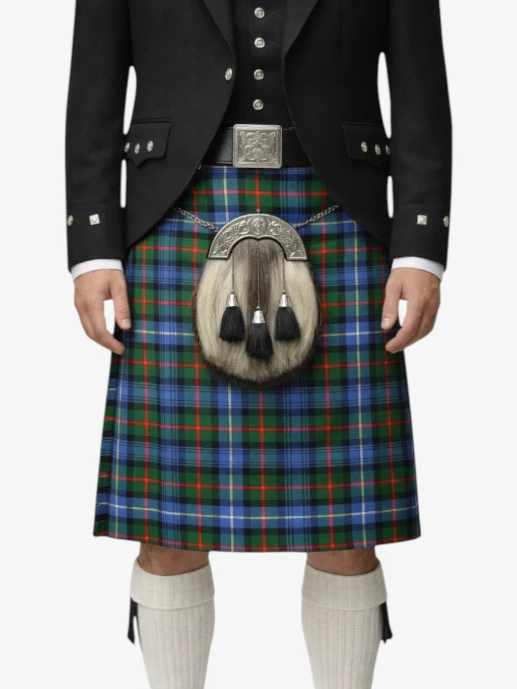 Person wearing a traditional Scottish kilt with a tartan pattern on a white background