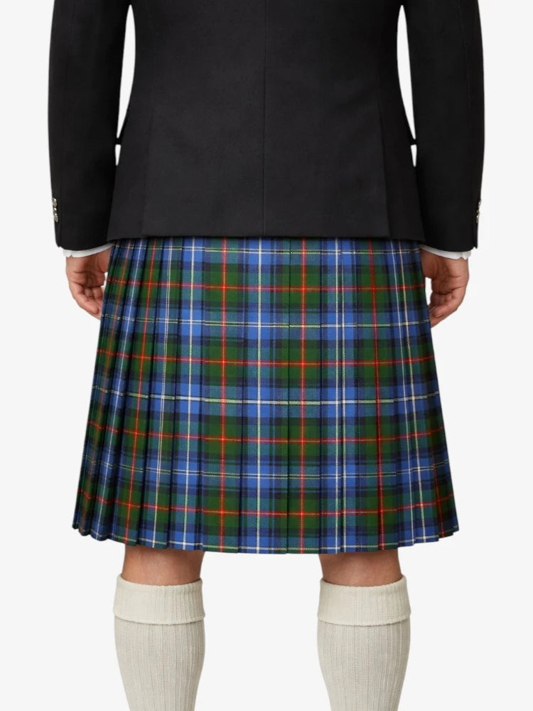 Person wearing a black jacket and plaid kilt on a white background