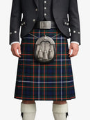 Person wearing a Scottish kilt with a tartan pattern on a white background