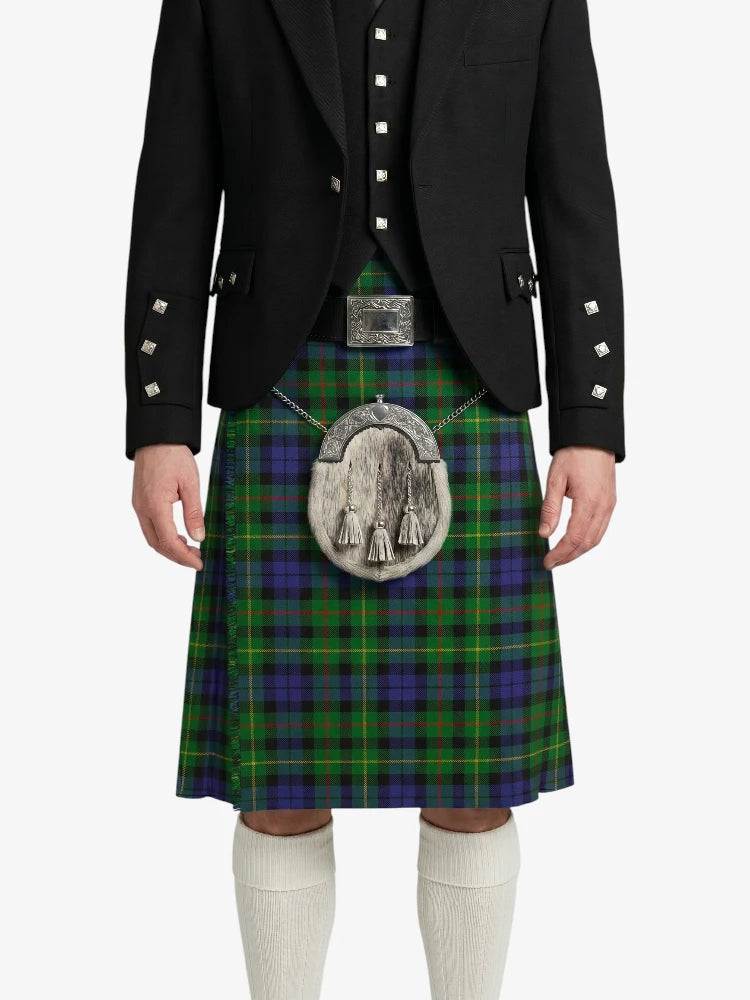 Person wearing a traditional Scottish kilt with a tartan pattern on a white background