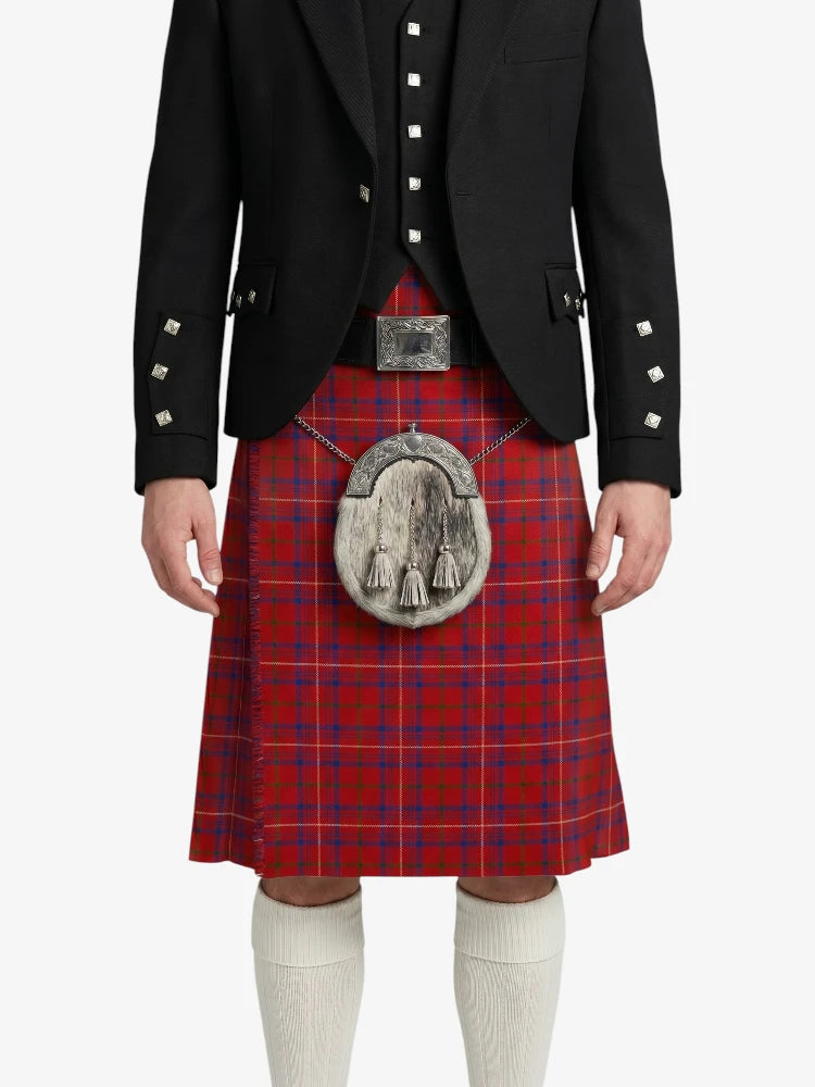 Person wearing a red tartan kilt with a black jacket on a white background