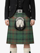 Person wearing a traditional Scottish kilt with a sporran on a white background