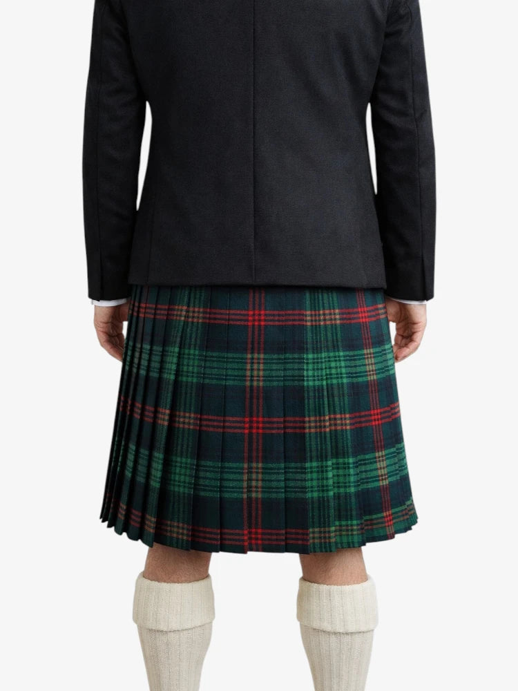 Person wearing a black coat and green plaid kilt on a white background