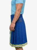 Person wearing a blue pleated skirt with reflective stripes on a white background