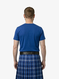 Man wearing a blue t-shirt and blue plaid kilt on a white background