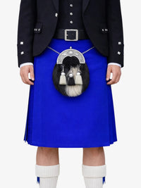 Person wearing a blue kilt with a sporran on a white background