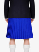 Person wearing a black jacket and blue pleated kilt on a white background