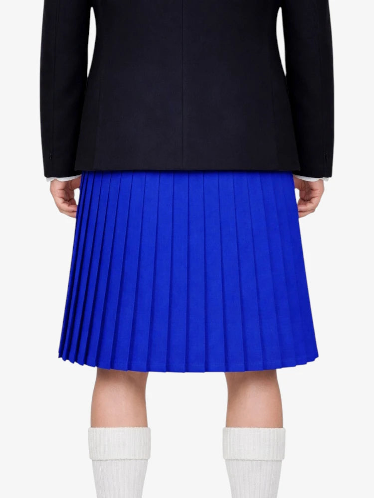 Person wearing a black jacket and blue pleated kilt on a white background