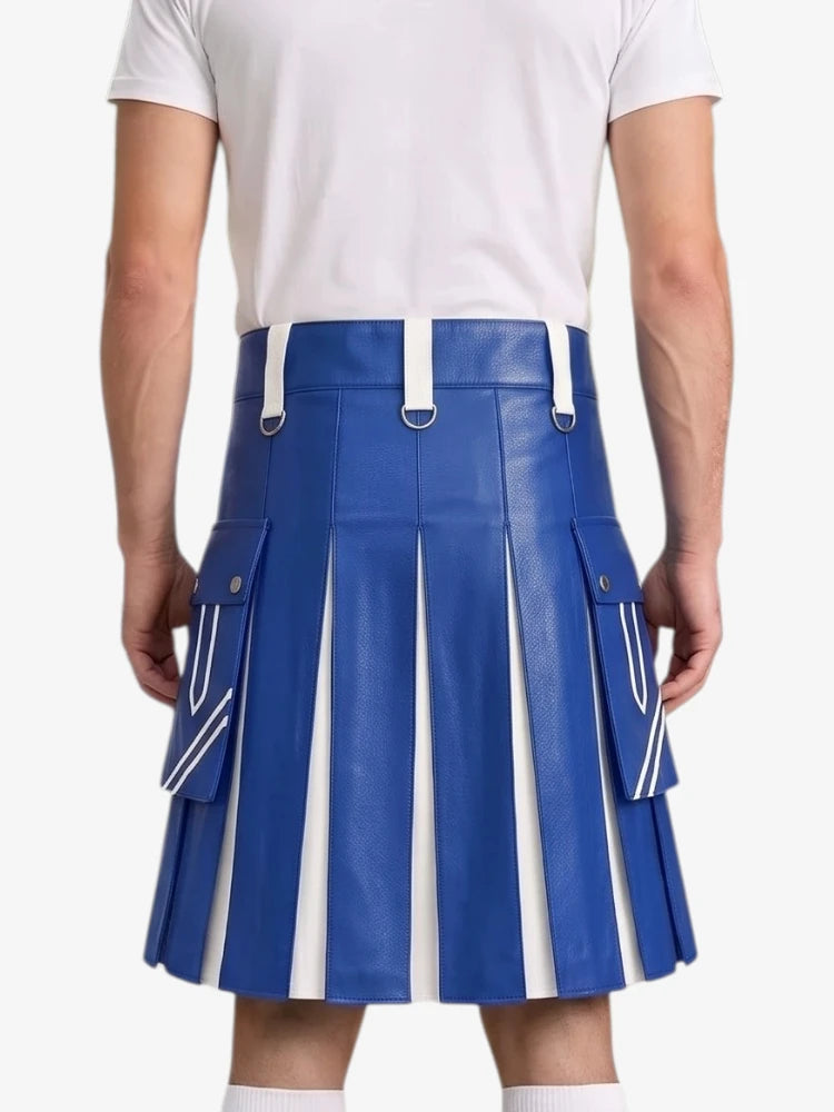 A person shown from the back wearing a bright blue pleated mini skirt with white side panels and white belt loops, paired with a white t-shirt against a light gray studio background.