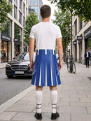 A man stands on a city sidewalk facing away from the camera, wearing a white T-shirt and a blue pleated kilt with white vertical stripes, white knee-high socks, and black shoes. Buildings, trees, a black car, and a bicycle are visible in the urban background.