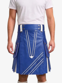 A man wearing a bright blue faux-leather kilt with white contrast stitching and silver-tone hardware, paired with a white t-shirt, shown from the chest down against a light gray background.