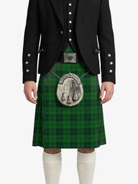 Person wearing a green kilt with a black jacket on a white background