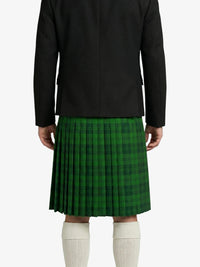 Person wearing a black jacket and green plaid kilt on a white background