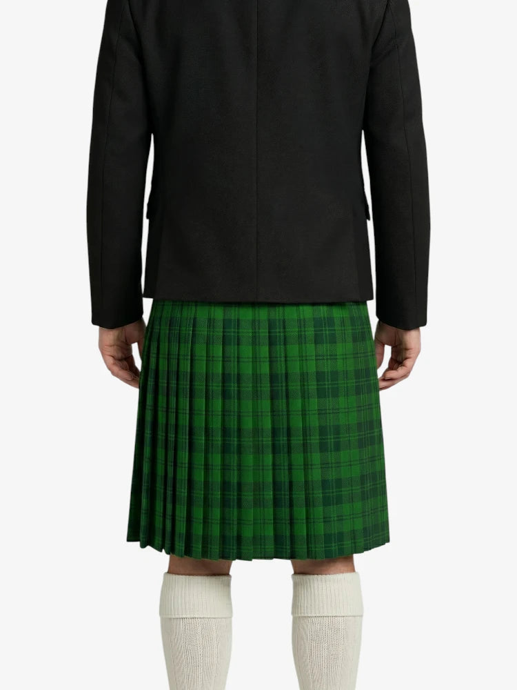 Person wearing a black jacket and green plaid kilt on a white background