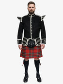 Man wearing a black doublet jacket with white trim and a royal stewart tartan kilt on a white background