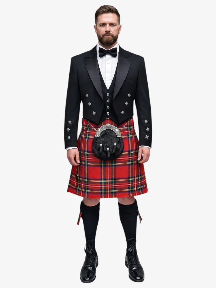 Man wearing a traditional Scottish royal stewart tartan kilt with a black prince charlie jacket and bow tie on a white background