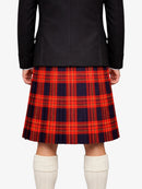 Person wearing a black jacket and red plaid kilt on a white background