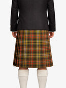 Person wearing a black jacket and plaid kilt on a white background