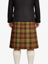 Person wearing a black jacket and plaid kilt on a white background