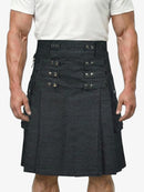 Black kilt with button details worn by a person on a white background