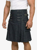 Black kilt with metal buttons worn by a person on a white background