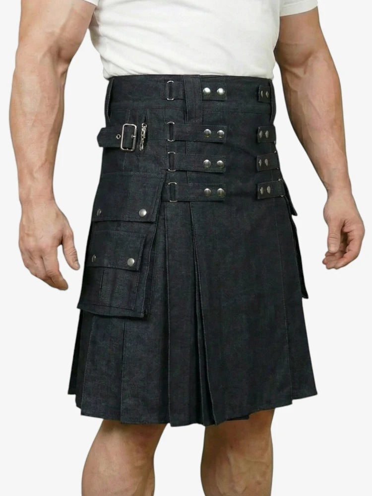 Black kilt with silver buckles worn by a person on a white background