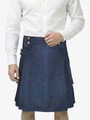 Person wearing a blue denim kilt with gold buttons on a white background