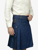 Person wearing a blue denim kilt with gold buttons on a white background