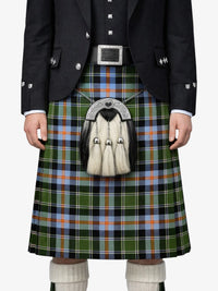 Person wearing a traditional Scottish kilt with a sporran on a white background