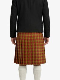 Person wearing a black jacket and red plaid skirt on a white background