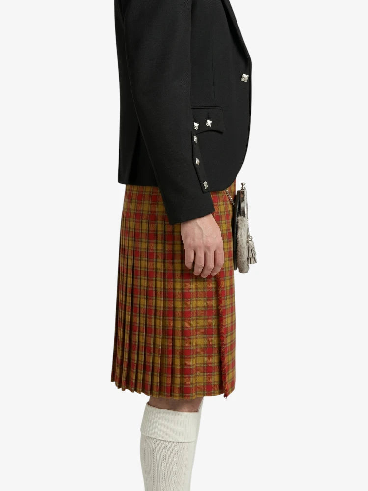 Person wearing a black blazer and red plaid kilt on a white background